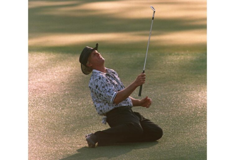 14 Apr 1996 :  Greg Norman of Australia collapses on the ground after narrowly missing his chip shot on the 15th green during the final tound of the 1996 US Masters Golf Championship at the Augusta National Golf Club in Augusta, Georgia. Nick Faldo wenton to win the event from Greg Norman. Mandatory Credit: Stephen Munday/ALLSPORT