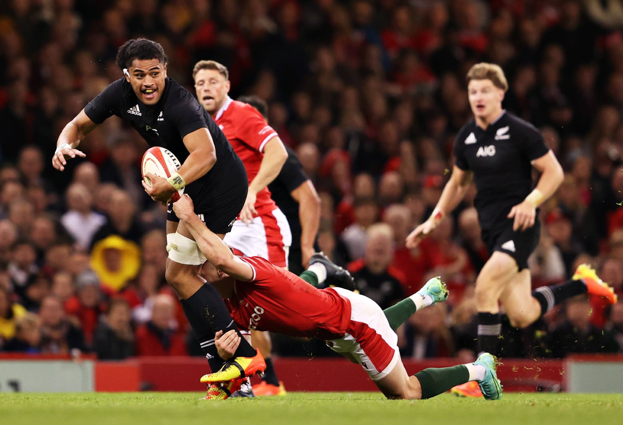 Tupou Vaa'i of New Zealand is tackled by Josh Adams of Wales during the Autumn International match between Wales and New Zealand at Principality Stadium on October 30, 2021 in Cardiff, Wales. (Photo by Warren Little/Getty Images)