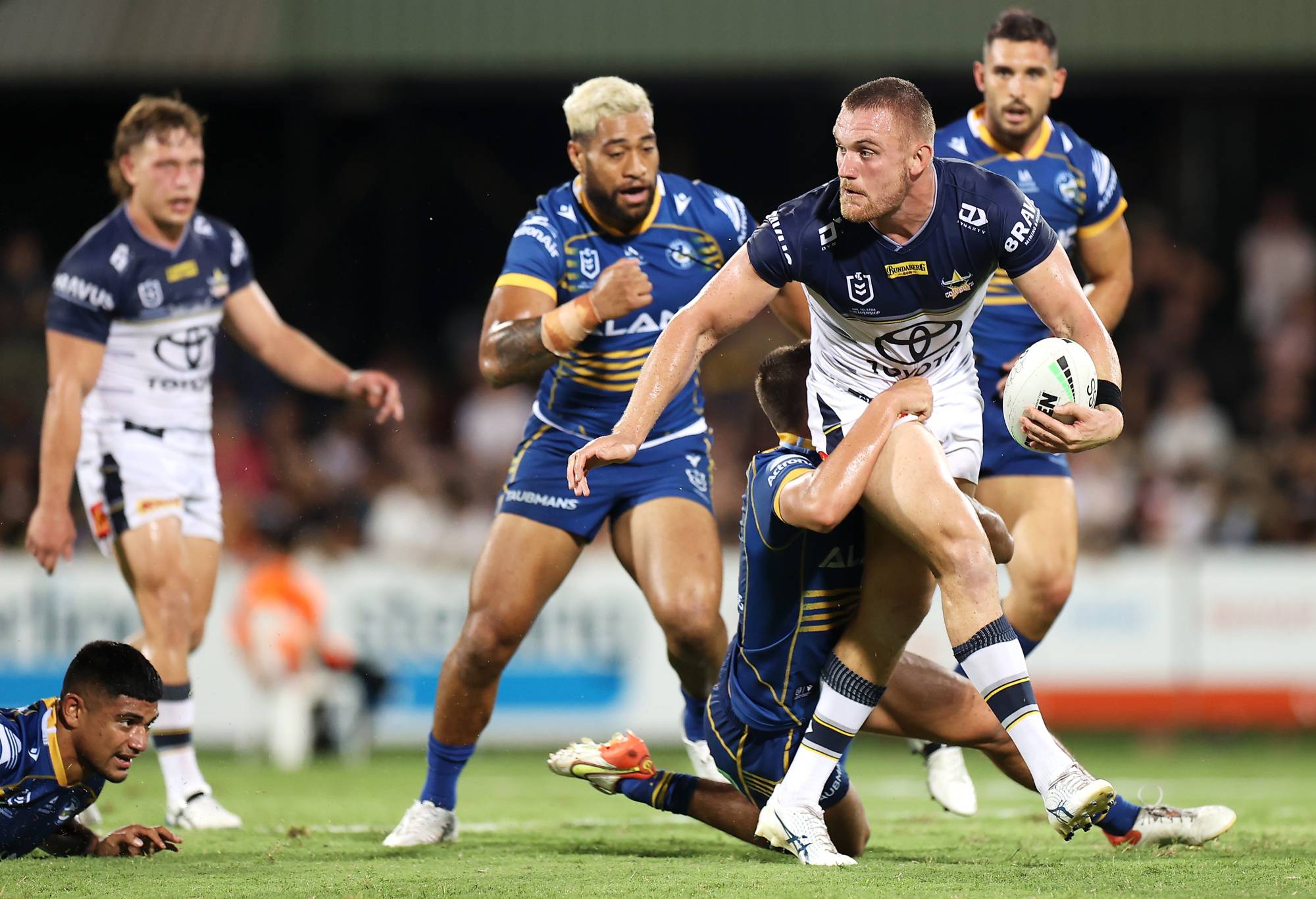DARWIN, AUSTRALIA - APRIL 30: Coen Hess of the Cowboys looks to pass as he is tackled during the round eight NRL match between the Parramatta Eels and the North Queensland Cowboys at TIO Stadium, on April 30, 2022, in Darwin, Australia. (Photo by Mark Kolbe/Getty Images)