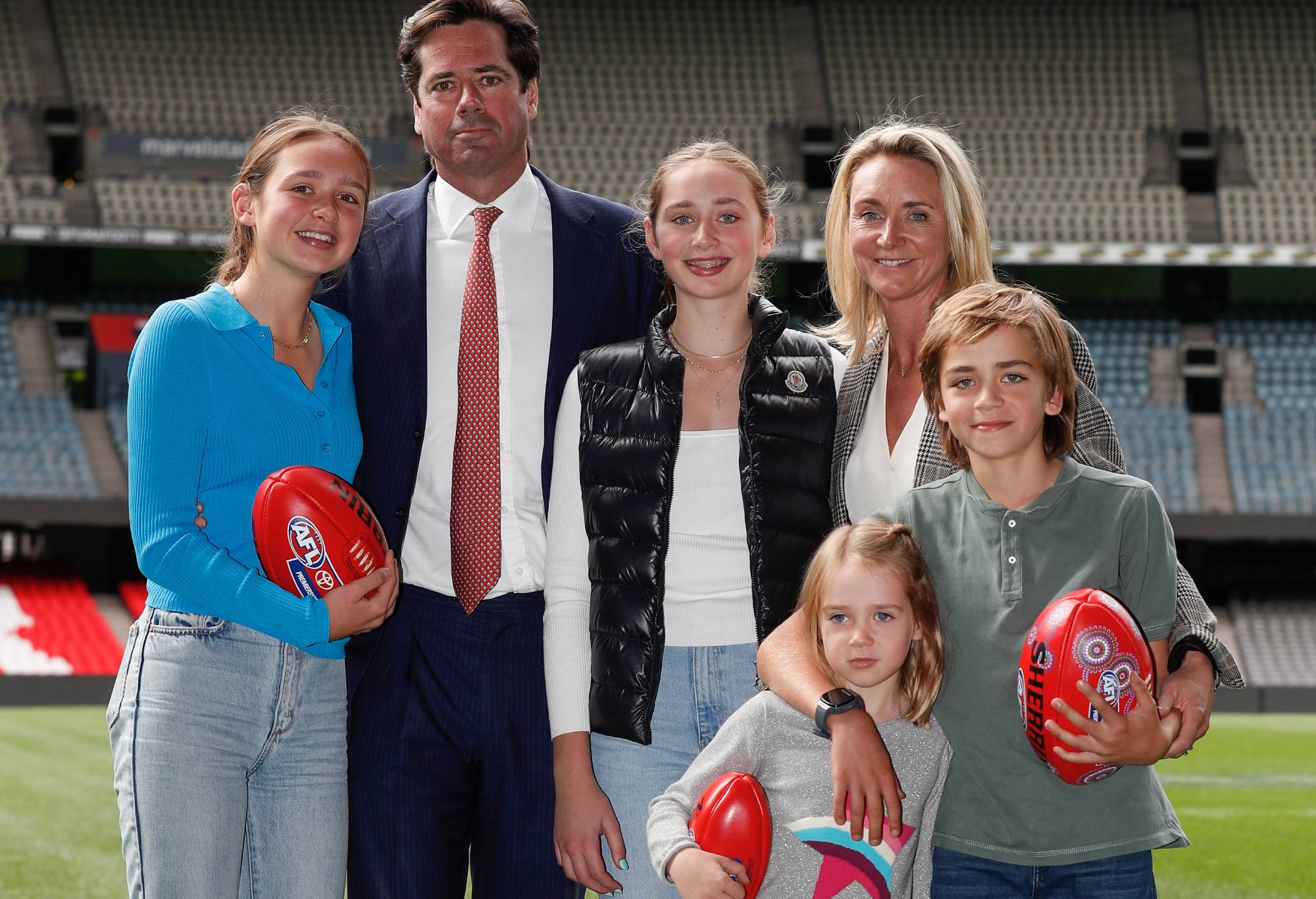 Gillon McLachlan, Chief Executive Officer of the AFL poses for a photograph with children Sydney, Edie, Cleo, Luna and wife Laura speaks to media after announcing he will step down from his role at the end of the season during an AFL Press Conference at AFL House on April 22, 2022 in Melbourne, Australia. (Photo by Michael Willson/AFL Photos via Getty Images)