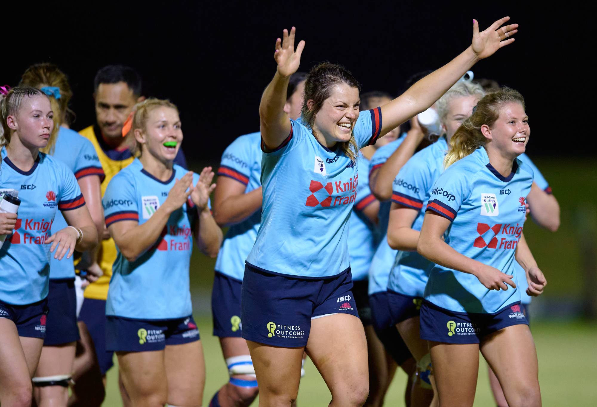 Grace Hamilton of the Waratahs celebrates victory with team mates during the Super W Semi Final match between the NSW Waratahs and the Queensland Reds at Eric Tweedale Stadium on April 14, 2022 in Sydney, Australia. (Photo by Brett Hemmings/Getty Images)
