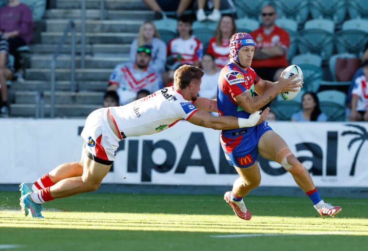 WOLLONGONG, AUSTRALIA - APRIL 17: Kalyn Ponga of the Knights is tackled during the round six NRL match between the St George Illawarra Dragons and the Newcastle Knights at WIN Stadium, on April 17, 2022, in Wollongong, Australia. (Photo by Mark Evans/Getty Images)