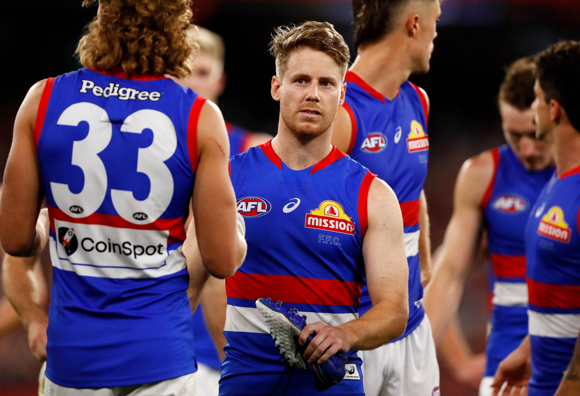 Lachie Hunter of the Bulldogs looks dejected after a loss during the 2022 AFL Round 01 match between the Melbourne Demons and the Western Bulldogs at the Melbourne Cricket Ground on March 16, 2022 In Melbourne, Australia. (Photo by Dylan Burns/AFL Photos via Getty Images)