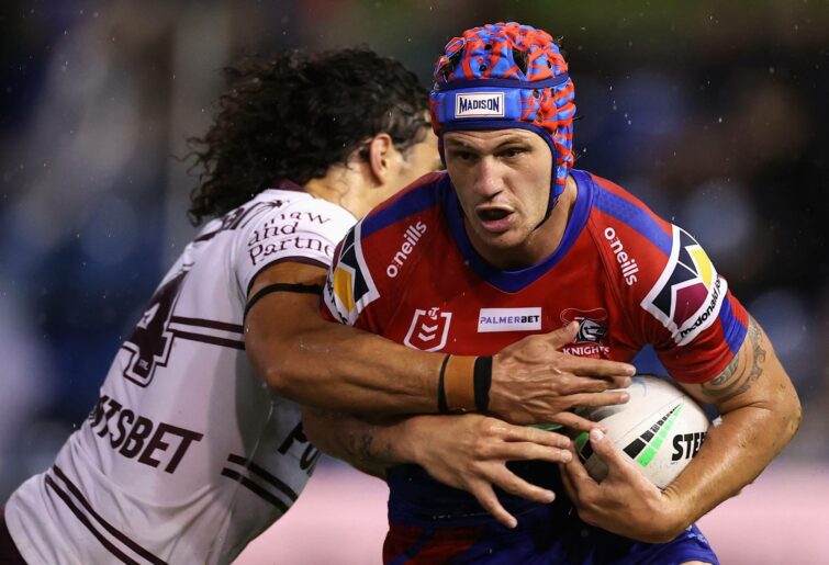 NEWCASTLE, AUSTRALIA - APRIL 07: Kalyn Ponga of the Knights is tackled during the round five NRL match between the Newcastle Knights and the Manly Sea Eagles at McDonald Jones Stadium, on April 07, 2022, in Newcastle, Australia. (Photo by Cameron Spencer/Getty Images)