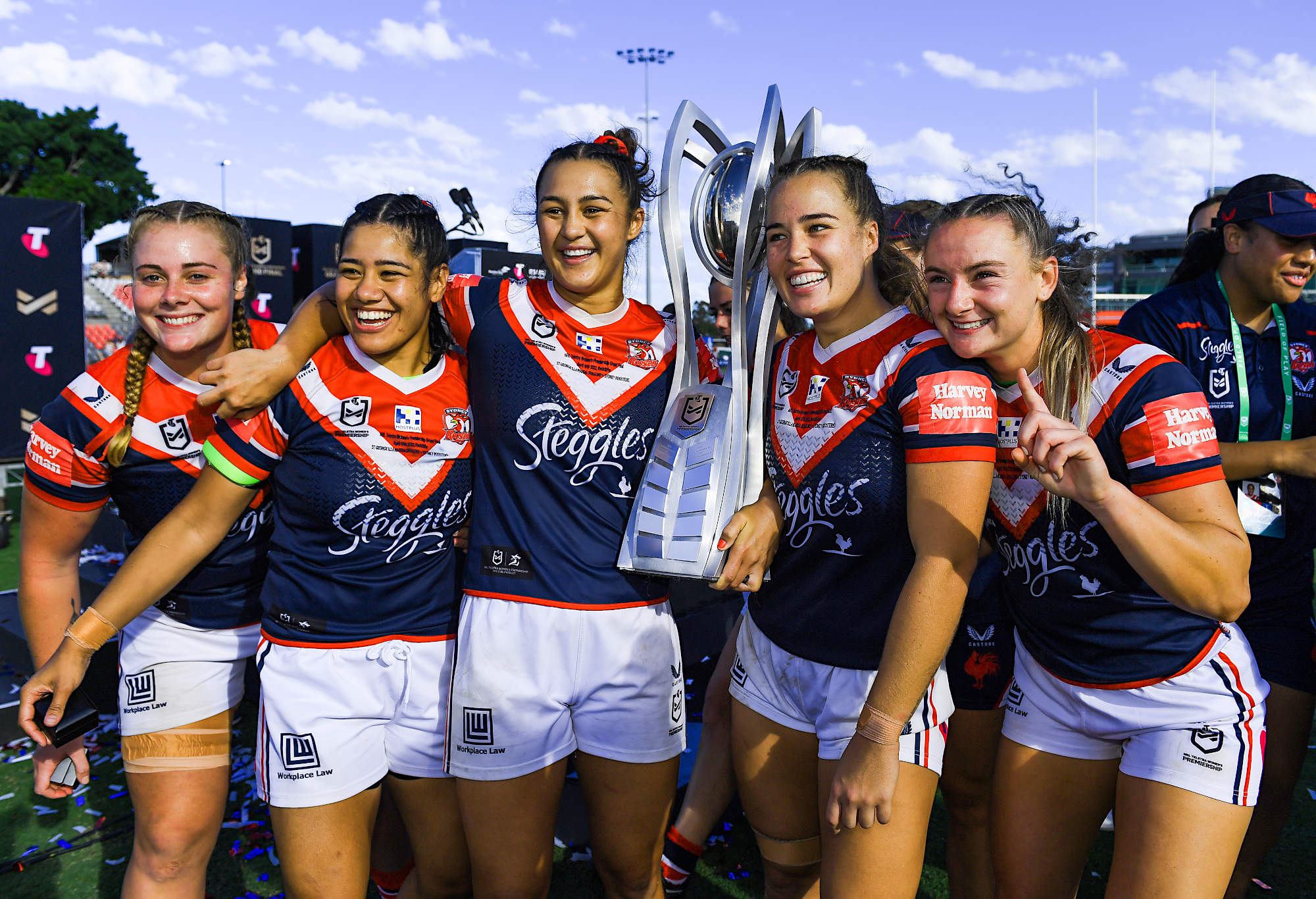 Roosters players celebrate their 2022 NRLW premiership title
