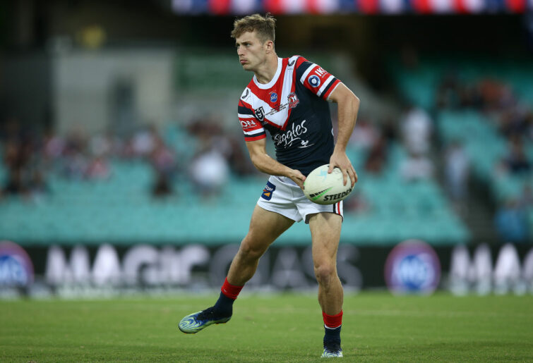 Sam Walker of the Roosters warms up.