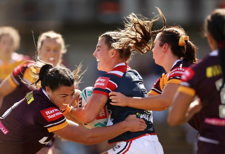 Jessica Sergis of the Roosters is tackled