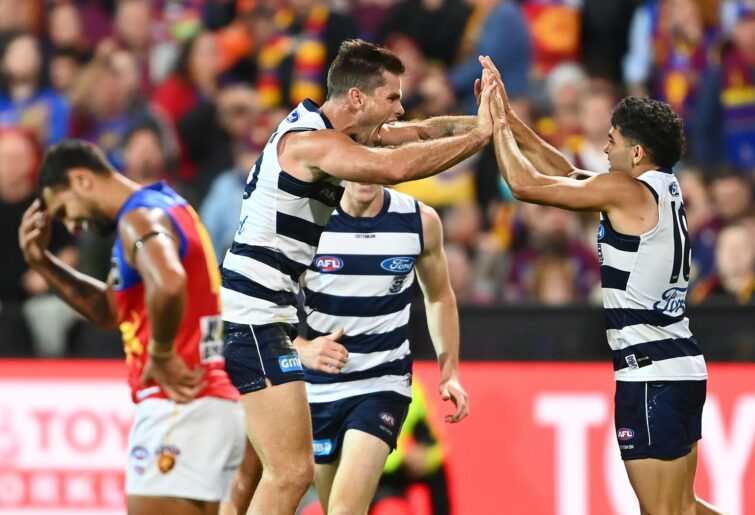 : Tom Hawkins of the Cats is congratulated by Tyson Stengle after kicking a goal during the round four AFL match between the Geelong Cats and the Brisbane Lions at GMHBA Stadium on April 08, 2022 in Geelong, Australia. (Photo by Quinn Rooney/Getty Images)