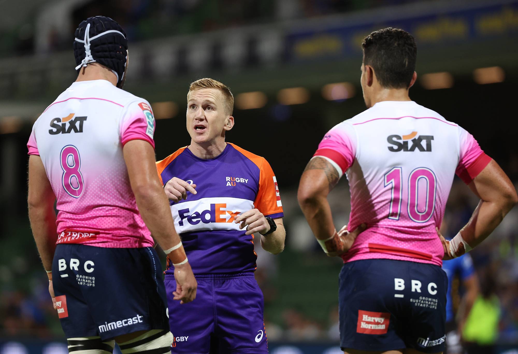 Referee Damon Murphy talks with Michael Wells Matt To'omua of the Rebels following a tackle during the round eight Super Rugby Pacific match between the Western Force and the Melbourne Rebels at HBF Park on April 08, 2022 in Perth, Australia. (Photo by Paul Kane/Getty Images)