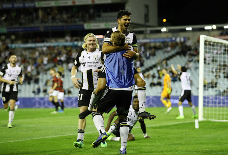 Ulises Davila celebrates a goal with teammates