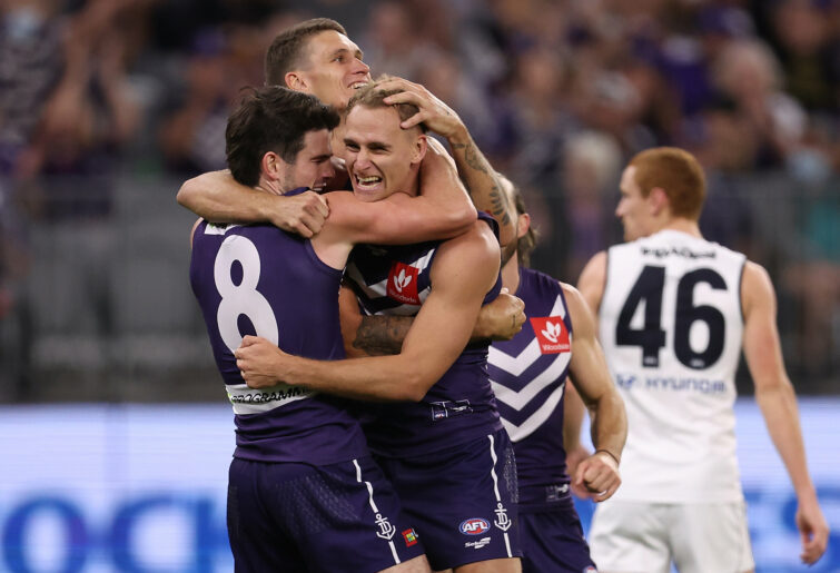 Will Brodie celebrates a goal with his Fremantle teammates. (Photo by Paul Kane/Getty Images)