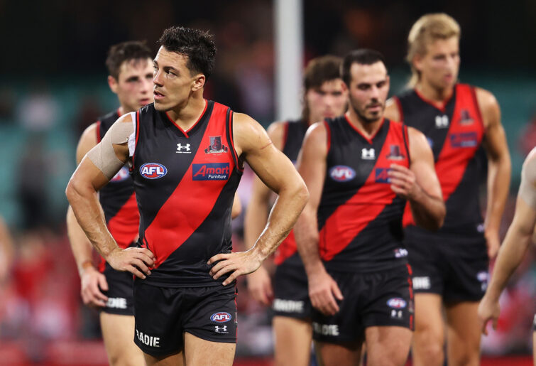 Dylan Shiel leaves the SCG with his Essendon teammates. 