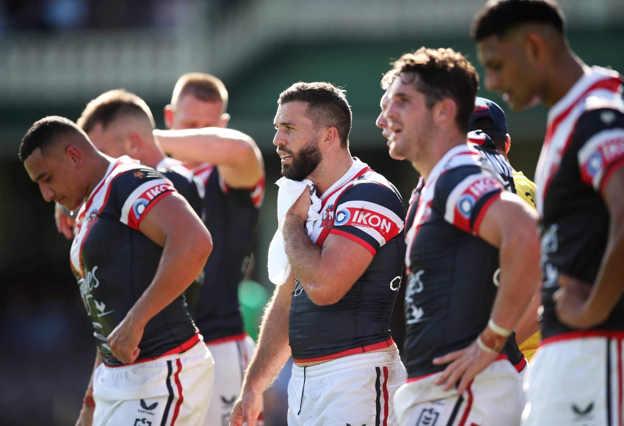 SYDNEY, AUSTRALIA - MARCH 12: James Tedesco of the Roosters and team mates look dejected after a Knights try during the round one NRL match between the Sydney Roosters and the Newcastle Knights at Sydney Cricket Ground, on March 12, 2022, in Sydney, Australia. (Photo by Matt King/Getty Images)