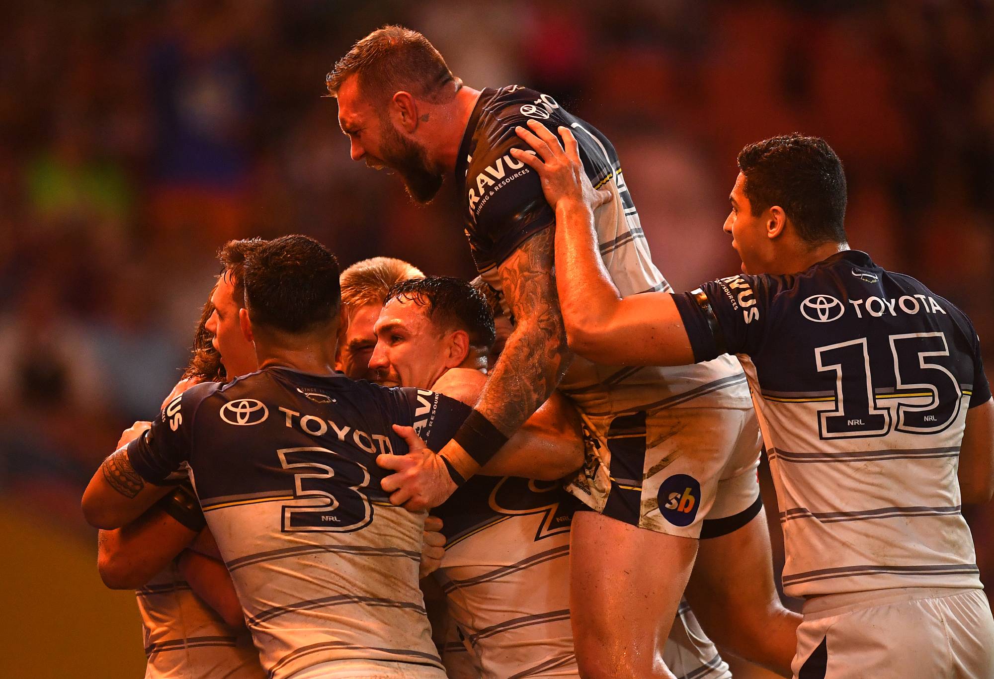 BRISBANE, AUSTRALIA - MAY 15: Cowboys celebrate a Reuben Cotter try during the round 10 NRL match between the Wests Tigers and the North Queensland Cowboys at Suncorp Stadium, on May 15, 2022, in Brisbane, Australia. (Photo by Albert Perez/Getty Images)