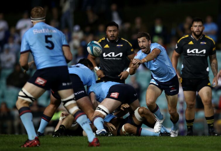 Jake Gordon of the Waratahs passes during the round 13 Super Rugby Pacific match between the NSW Waratahs and the Hurricanes at Leichhardt Oval on May 14, 2022 in Sydney, Australia. (Photo by Jason McCawley/Getty Images)