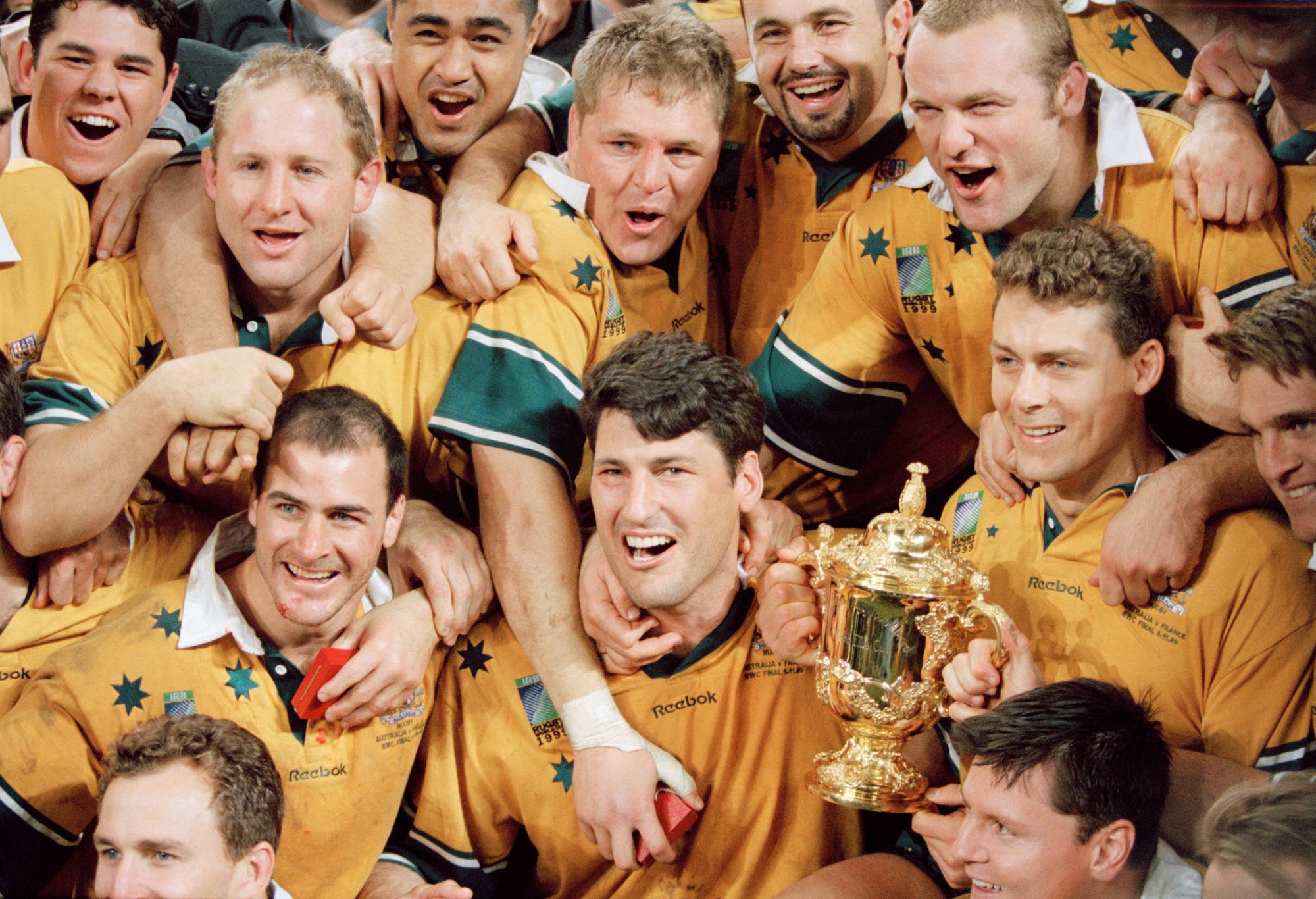 Australian captain John Eales (C) and his teammates celebrate after winning the 1999 Rugby Union World Cup final against France. Australia won the final 35 to 12. (Photo by Franck Seguin/Corbis/VCG via Getty Images)