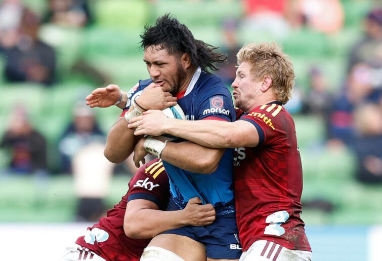 Pone Fa'amausili of the Rebels is tackled during the round 15 Super Rugby Pacific match between the Melbourne Rebels and the Highlanders at AAMI Park on May 29, 2022 in Melbourne, Australia. (Photo by Mike Owen/Getty Images)