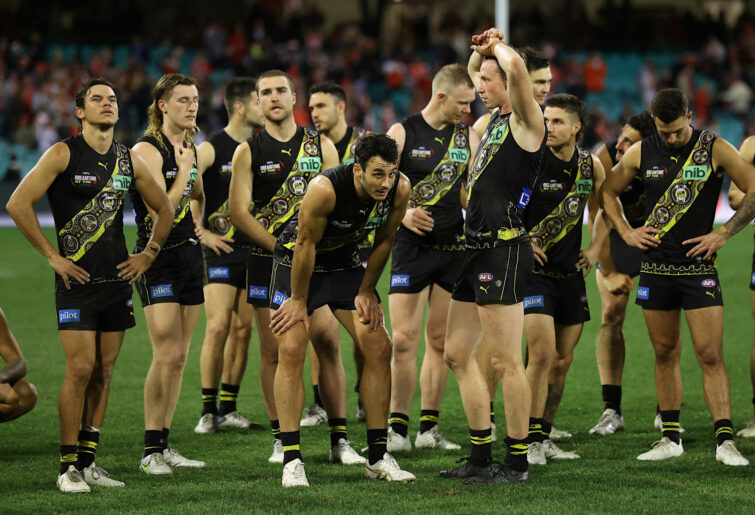 Tigers players look dejected after last-gasp loss to Sydney