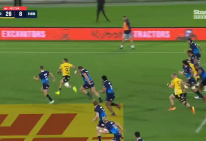 TJ Perenara zeroes in on his opposing No.9 with a high elbow