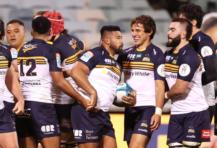 Folau Fainga'a of the Brumbies celebrates with his teammates after winning a try.
