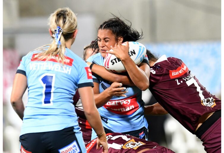 SUNSHINE COAST, AUSTRALIA - NOVEMBER 13: Yasmin Meakes of the Blues is tackled by Shaniah Power of the Maroons during the Women's State of Origin match between Queensland and New South Wales at Sunshine Coast Stadium on November 13, 2020 in Sunshine Coast, Australia. (Photo by Dan Peled/Getty Images)