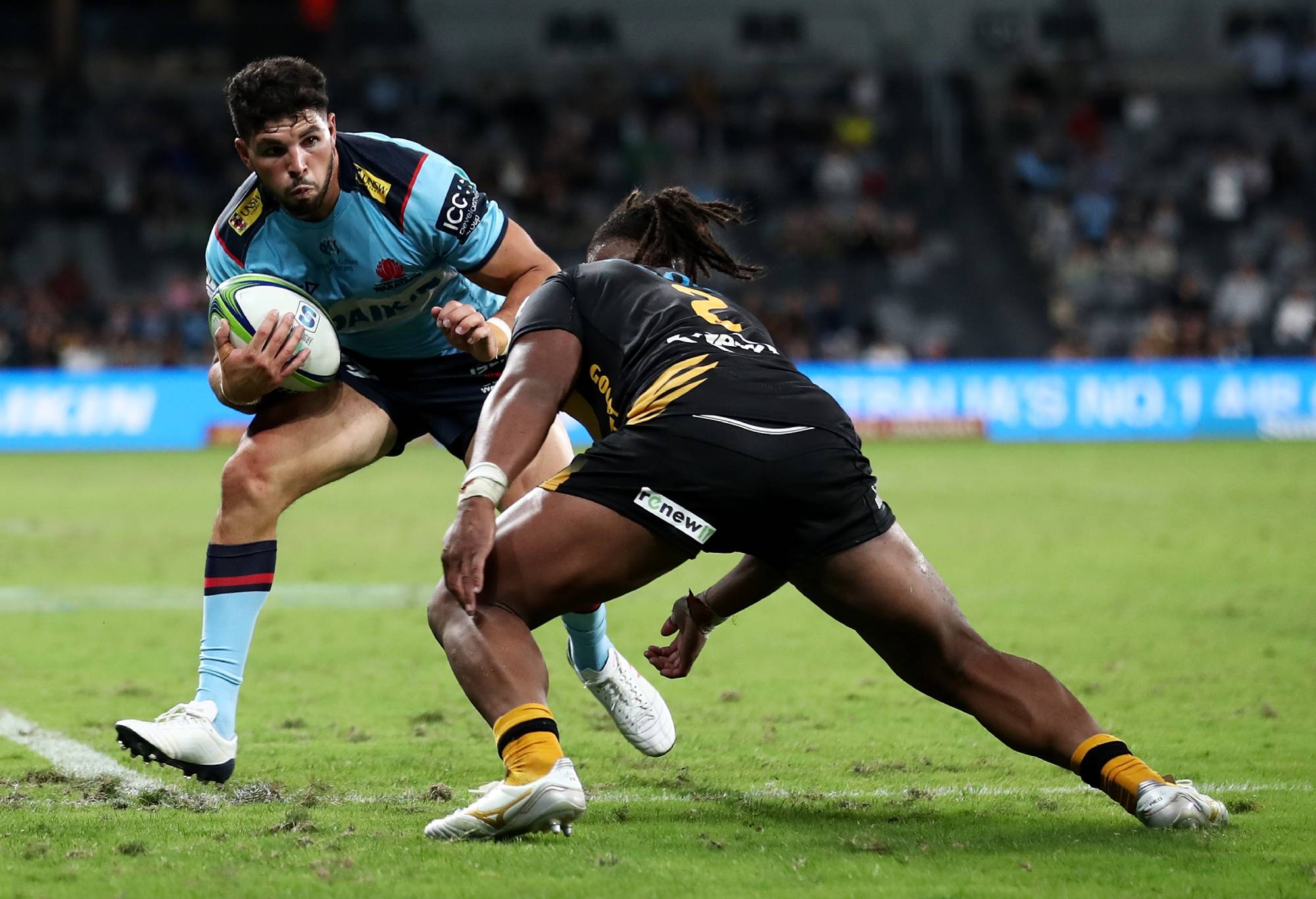 SYDNEY, AUSTRALIA - MARCH 05: Triston Reilly of the Waratahs is tackled during the round three Super RugbyAU match between the Waratahs and the Western Force at Bankwest Stadium, on March 05, 2021, in Sydney, Australia. (Photo by Cameron Spencer/Getty Images)