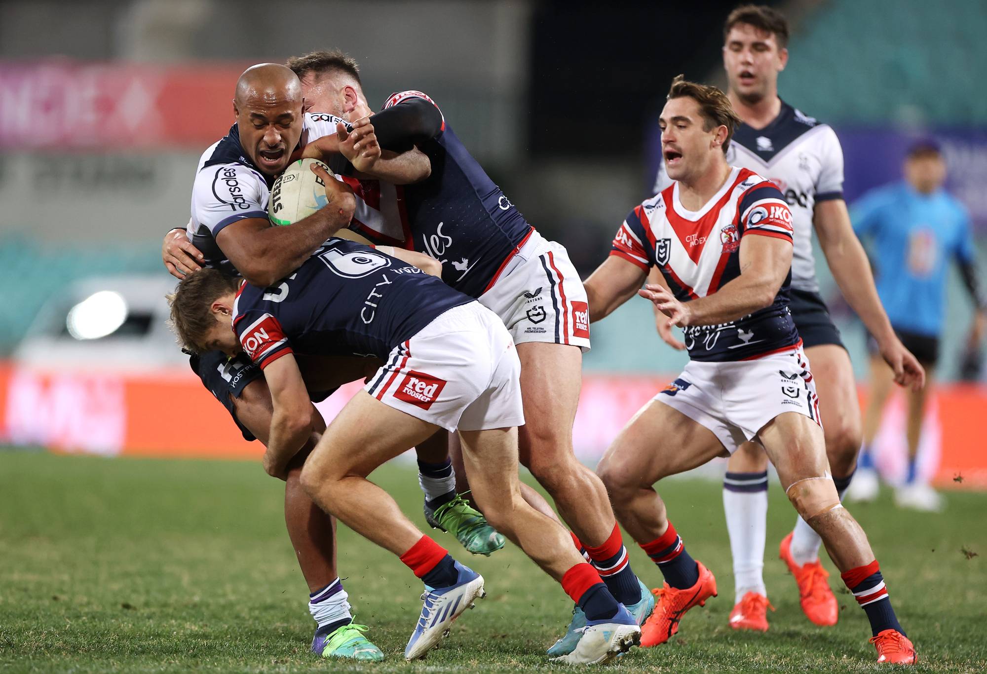 SYDNEY, AUSTRALIA - JUNE 11: Felise Kaufusi of the Storm is tackled during the round 14 NRL match between the Sydney Roosters and the Melbourne Storm at Sydney Cricket Ground, on June 11, 2022, in Sydney, Australia. (Photo by Mark Kolbe/Getty Images)