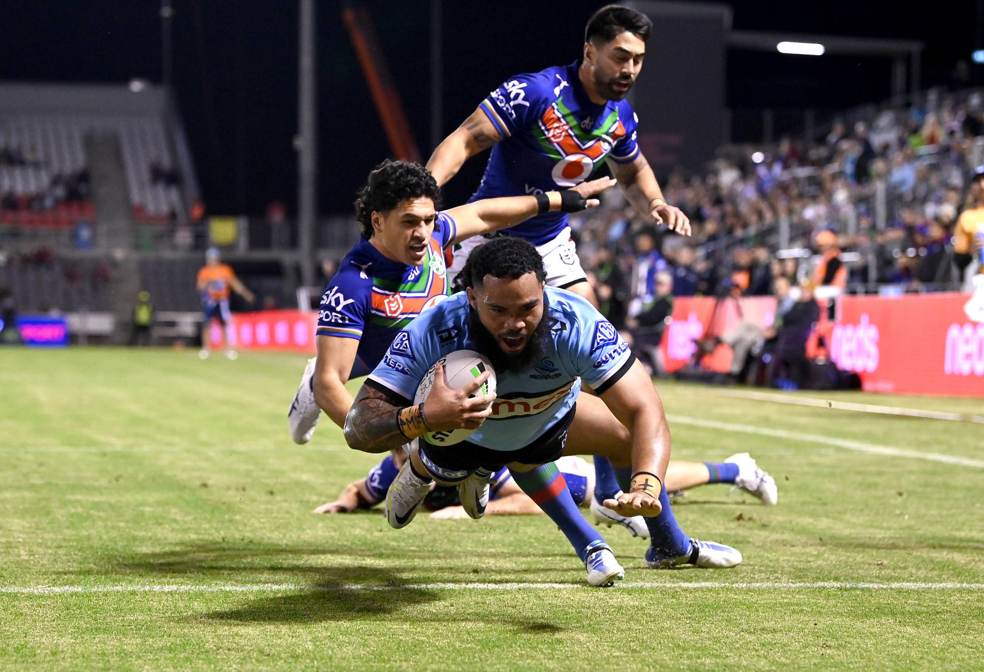 BRISBANE, AUSTRALIA - JUNE 12: Siosifa Talakai of the Sharks scores a try during the round 14 NRL match between the New Zealand Warriors and the Cronulla Sharks at Moreton Daily Stadium, on June 12, 2022, in Brisbane, Australia. (Photo by Bradley Kanaris/Getty Images)