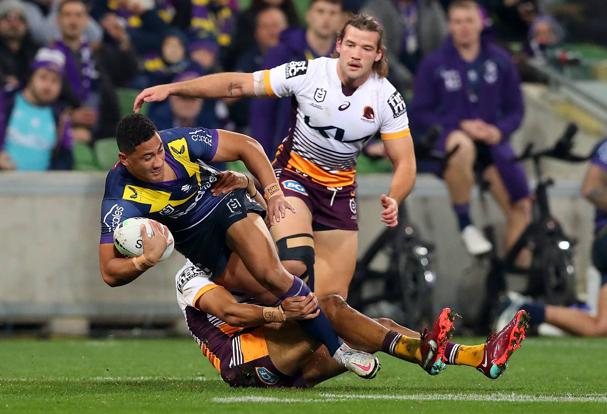 MELBOURNE, AUSTRALIA - JUNE 17: Dean Ieremia of the Storm is tackled during the round 15 NRL match between the Melbourne Storm and the Brisbane Broncos at AAMI Park, on June 17, 2022, in Melbourne, Australia. (Photo by Kelly Defina/Getty Images)