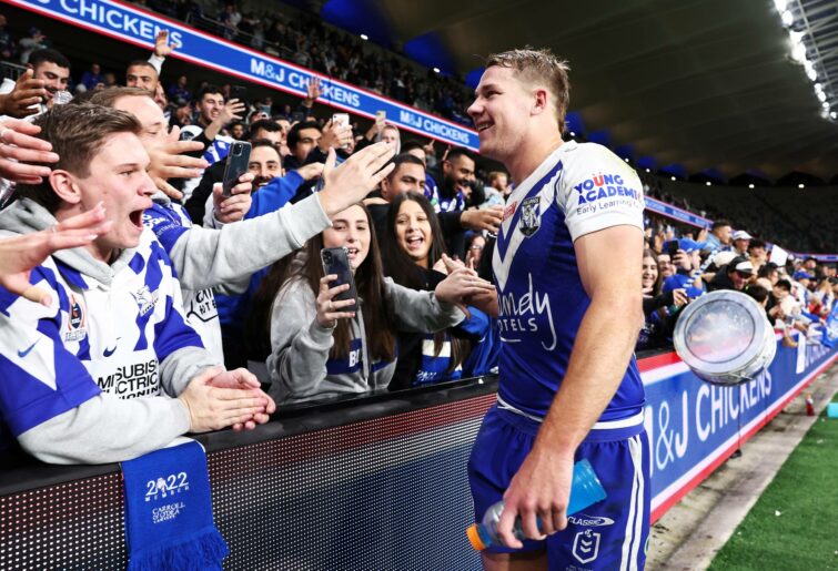SYDNEY, AUSTRALIA - JUNE 19: Matt Burton of the Bulldogs celebrates victory with fans after the round 15 NRL match between the Canterbury Bulldogs and the Wests Tigers at CommBank Stadium, on June 19, 2022, in Sydney, Australia. (Photo by Matt King/Getty Images)
