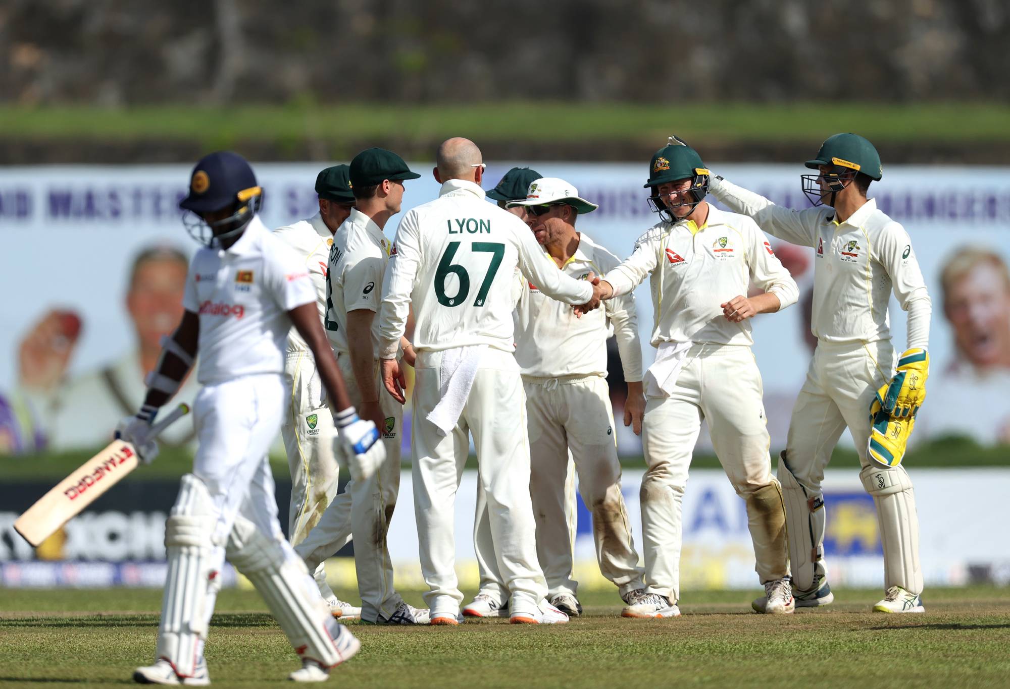GALLE, SRI LANKA - JUNE 29: Australian players celebrate after dismissing Lasith Embuldeniya of Sri Lanka during day one of the First Test in the series between Sri Lanka and Australia at Galle International Stadium on June 29, 2022 in Galle, Sri Lanka. (Photo by Buddhika Weerasinghe/Getty Images)