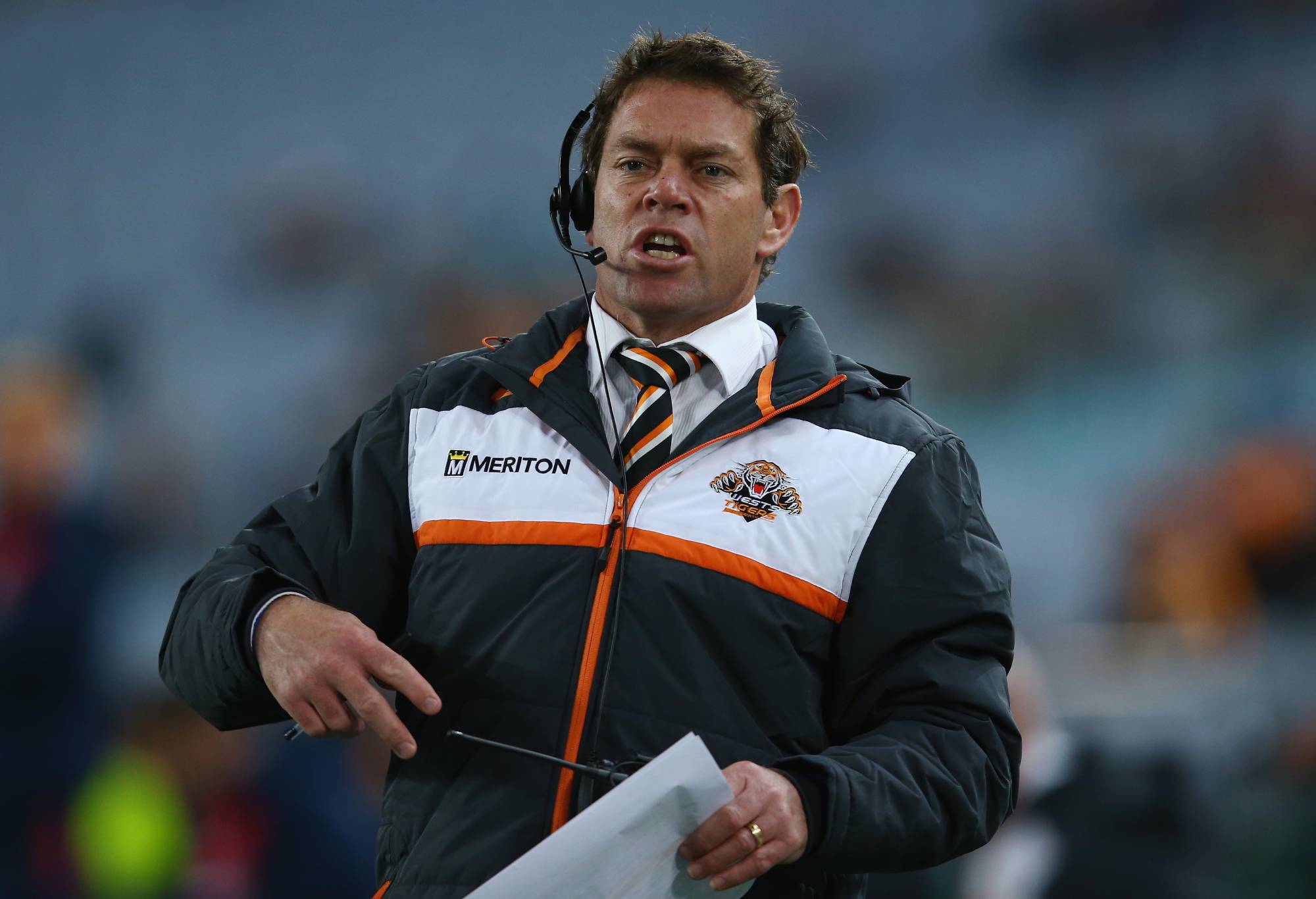 SYDNEY, AUSTRALIA - JULY 24: Tigers NYC coach Brett Kimmorley gives instructions from the bench during the round 20 NRL match between the Wests Tigers and the Sydney Roosters at ANZ Stadium on July 24, 2015 in Sydney, Australia. (Photo by Mark Kolbe/Getty Images)