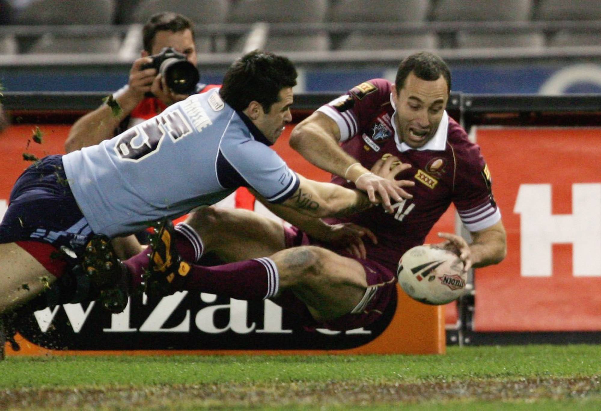 MELBOURNE, AUSTRALIA - JULY 05: Adam Mogg of Queensland scores a try during the match between the New South Wales Blues and Queensland Maroons in the NRL State of Origin Game 3 at the Telstra Dome, July 5, 2006 in Melbourne, Australia.  (Photo by Adam Pretty/Getty Images)