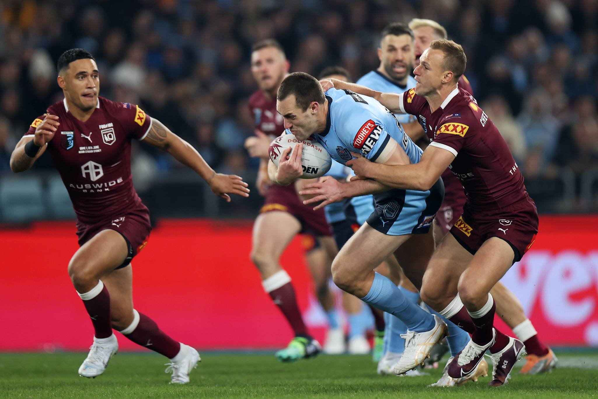Isaah Yeo of the Blues is tackled during game one of the 2022 State of Origin series between the New South Wales Blues and the Queensland Maroons at Accor Stadium on June 08, 2022, in Sydney, Australia. (Photo by Mark Kolbe/Getty Images)