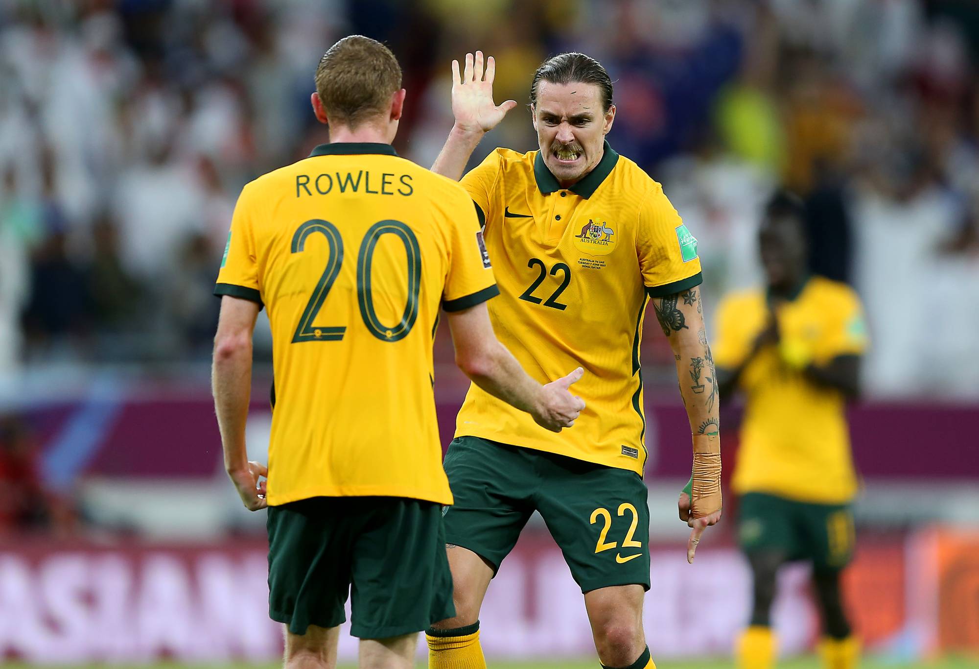 Jackson Irvine celebrates with Kye Rowles of Australia after their sides victory during the 2022 FIFA World Cup Playoff match between United Arab Emirates and Australia at Ahmad Bin Ali Stadium on June 07, 2022 in Doha, Qatar. (Photo by Mohamed Farag/Getty Images)