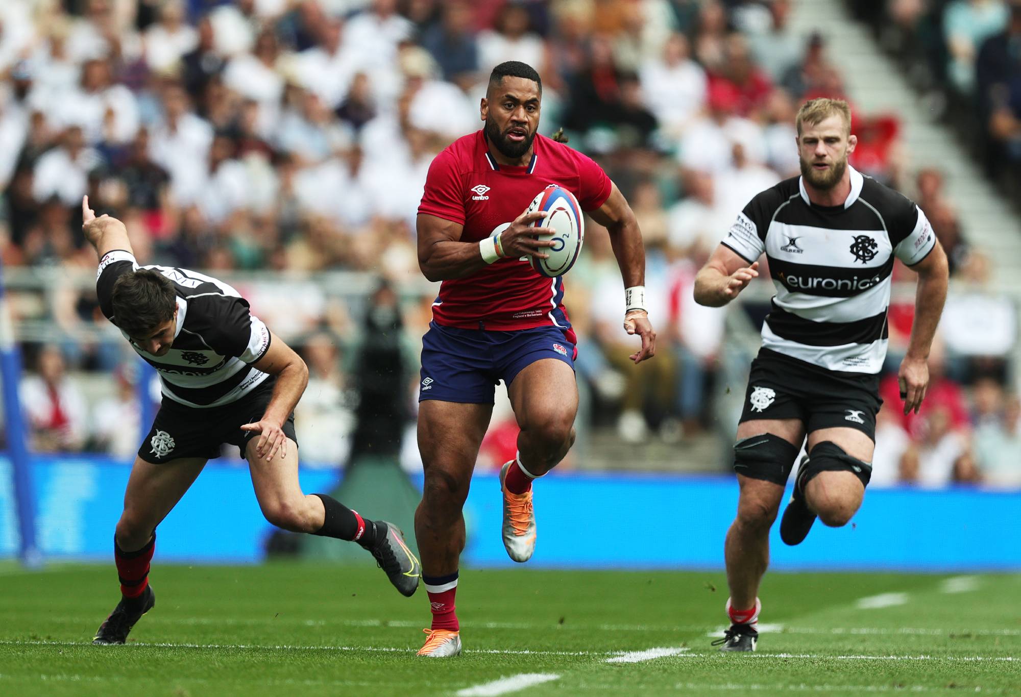 Joe Cokanasiga of England runs with the ball during the International match between England and Barbarians at Twickenham Stadium on June 19, 2022 in London, England. (Photo by David Rogers/Getty Images)