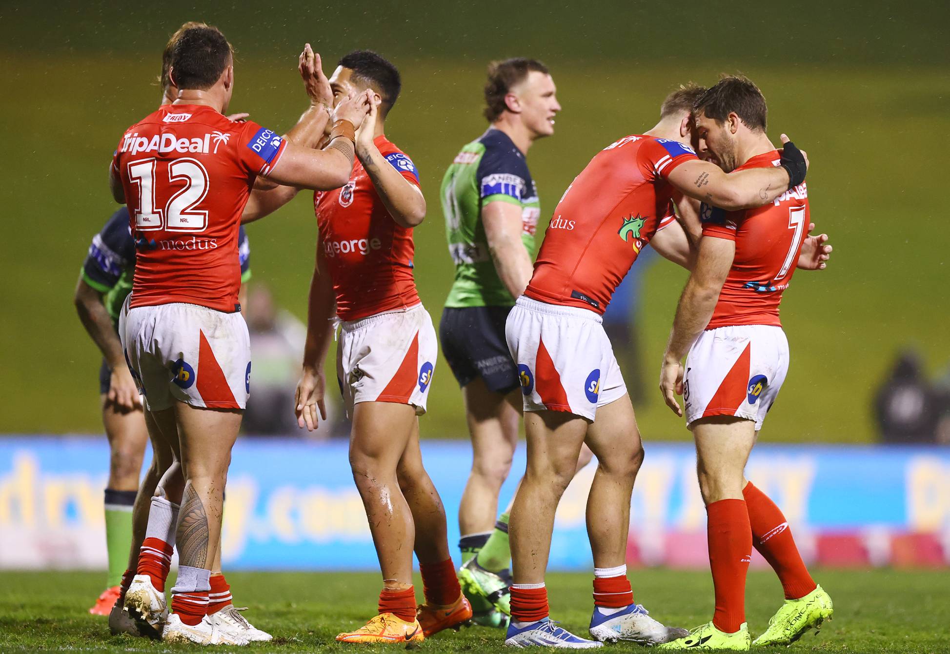 WOLLONGONG, AUSTRALIA - JULY 03: Dragon players celebrate winning the round 16 NRL match between the St George Illawarra Dragons and the Canberra Raiders at WIN Stadium, on July 03, 2022, in Wollongong, Australia. (Photo by Mark Nolan/Getty Images)