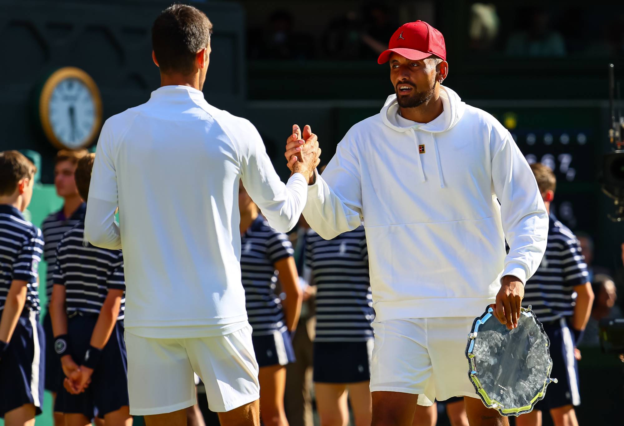 Nick Kyrgios of Australia congratulates Novak Djokovic of Serbia after their match during day fourteen of The Championships Wimbledon 2022 at All England Lawn Tennis and Croquet Club on July 10, 2022 in London, England. (Photo by Frey/TPN/Getty Images)