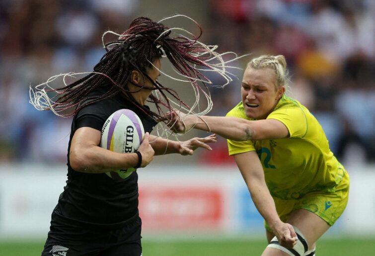 Maddison Levi of Team Australia pulls the hair of Portia Woodman of Team New Zealand during the Women's Rugby Sevens Semi-Final match between Team Australia and Team New Zealand on day two of the Birmingham 2022 Commonwealth Games at Coventry Stadium on July 30, 2022 on the Coventry, England. (Photo by Richard Heathcote/2022 Getty Images)