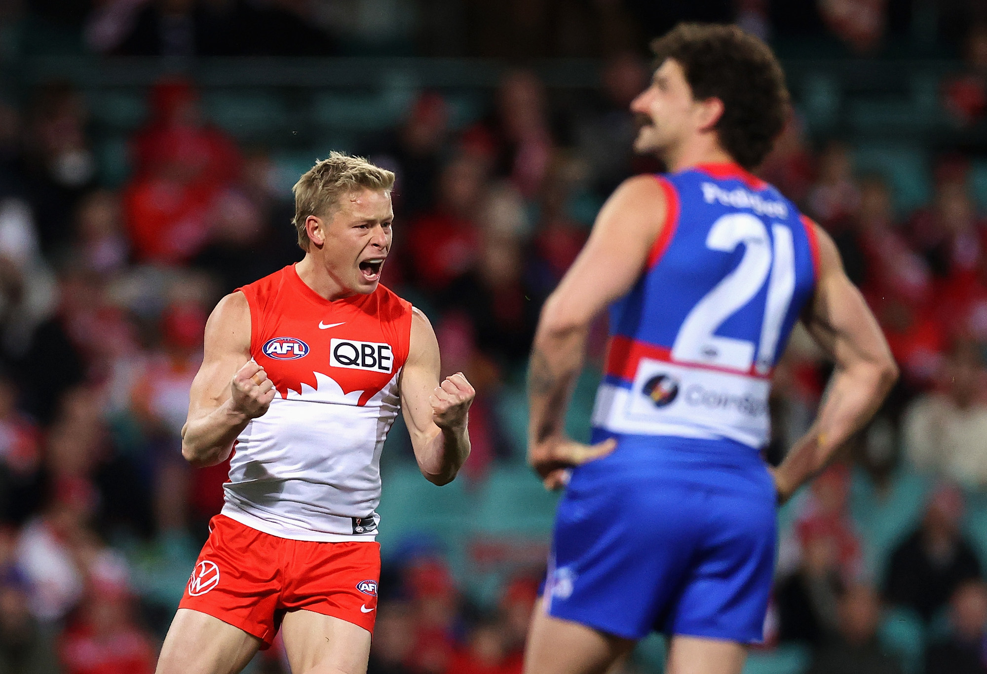 Isaac Heeney of the Swans celebrates kicking a goal.