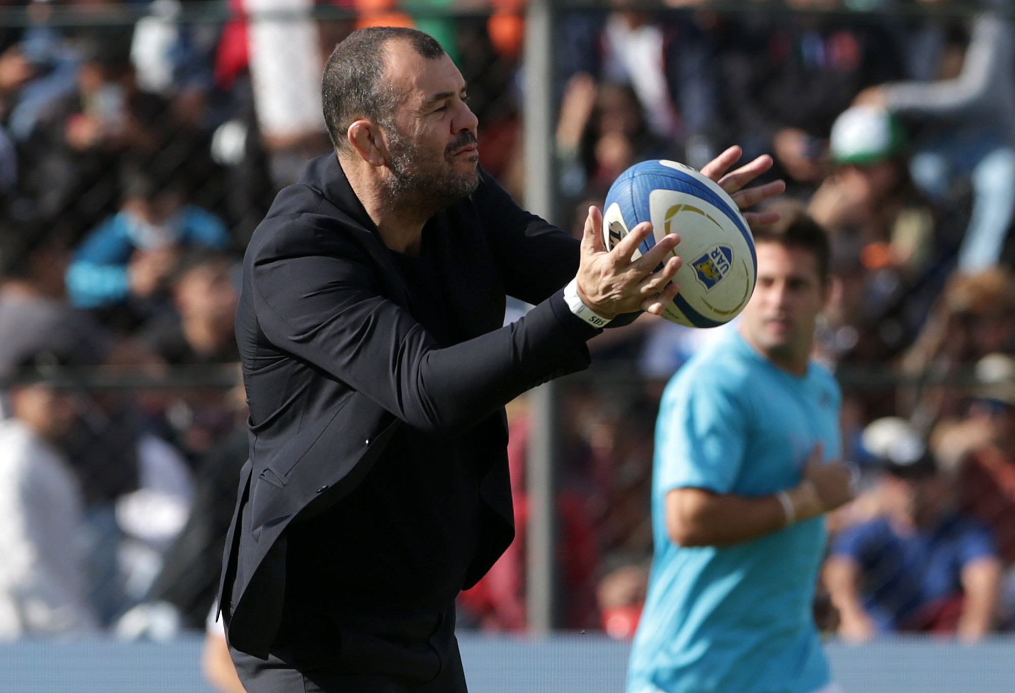 Michael Cheika, head coach of Argentina, catches the ball.