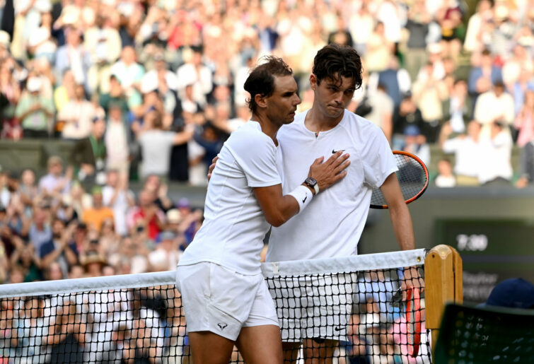 Rafael Nadal consoles Taylor Fritz.