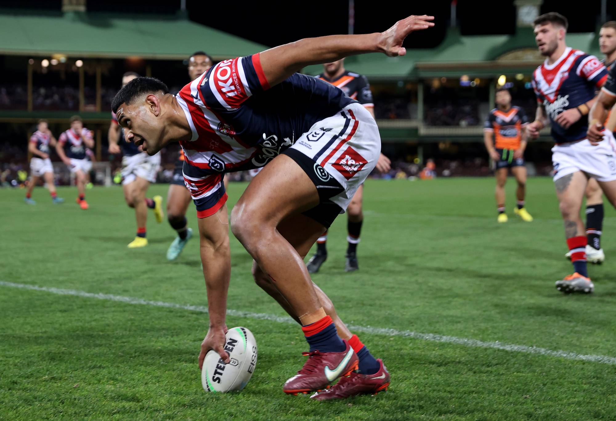 Daniel Tupou of the Roosters scores a try