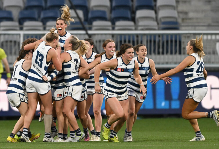 Geelong players celebrate after Georgie Prespakis kicked the winning goal against Richmond.