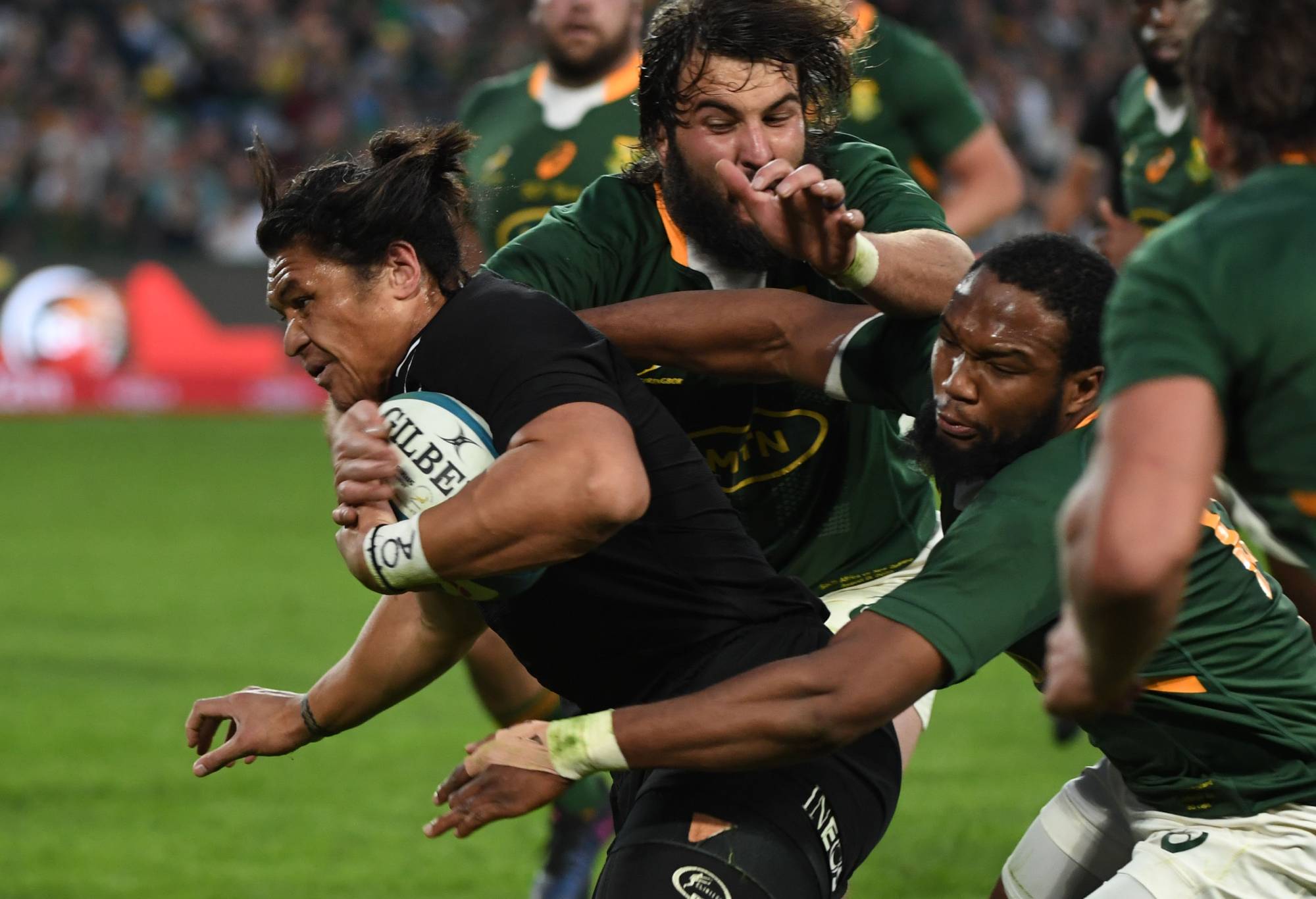 Caleb Clarke of NZ tacked by Lukhanyo Am of the Springbok during The Rugby Championship match between South Africa and New Zealand at Emirates Airline Park on August 13, 2022 in Johannesburg, South Africa. (Photo by Lee Warren/Gallo Images/Getty Images)