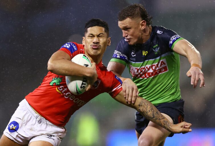 WOLLONGONG, AUSTRALIA - JULY 03: Talatau Amone of the Dragons is tackled by Jack Wighton of the Raiders during the round 16 NRL match between the St George Illawarra Dragons and the Canberra Raiders at WIN Stadium, on July 03, 2022, in Wollongong, Australia. (Photo by Mark Nolan/Getty Images)