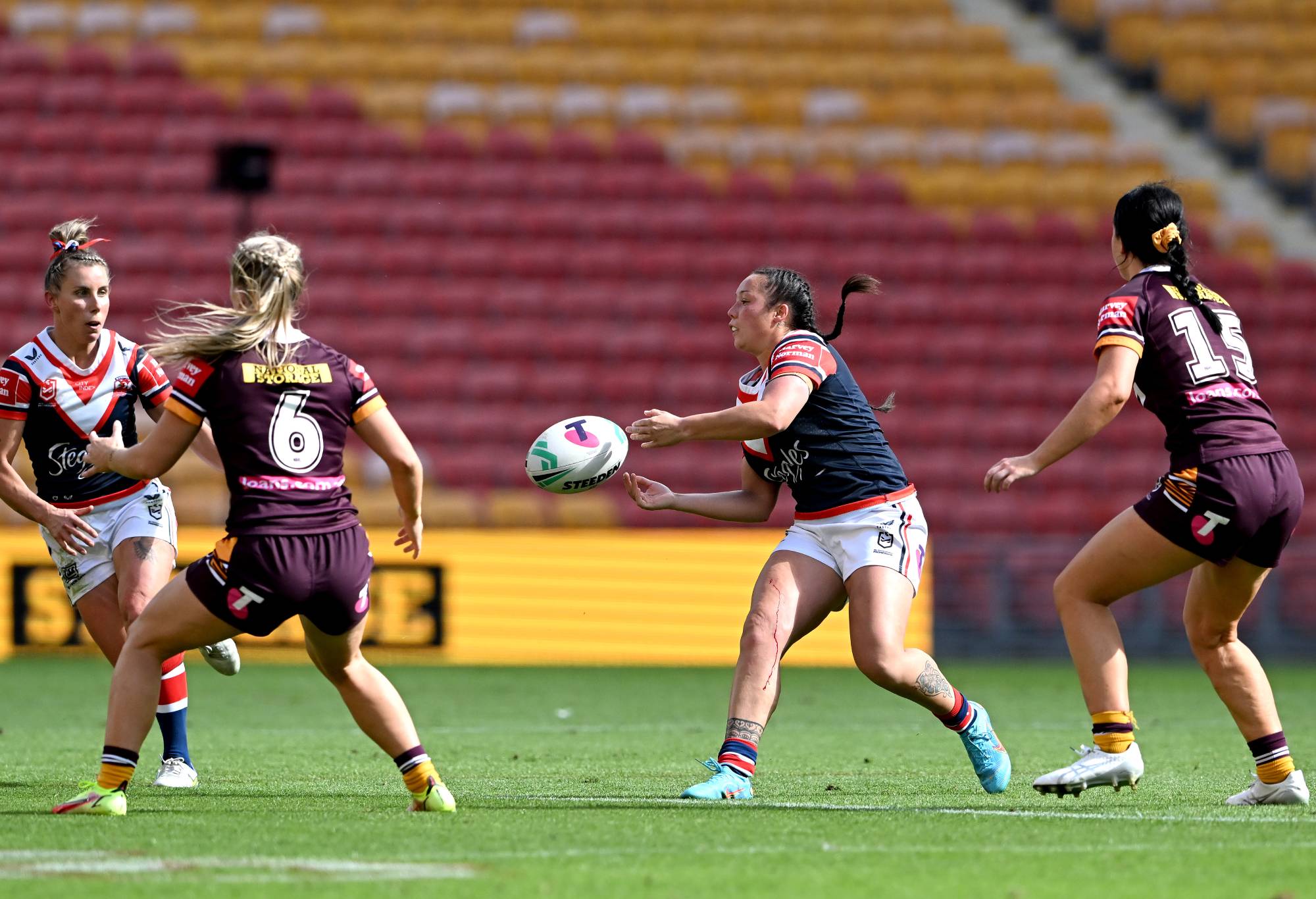 BRISBANE, AUSTRALIA - AUGUST 27: Raecene McGregor of the Roosters passes the ball during the round two NRLW match between Brisbane Broncos and Sydney Roosters at Suncorp Stadium, on August 27, 2022, in Brisbane, Australia. (Photo by Bradley Kanaris/Getty Images)