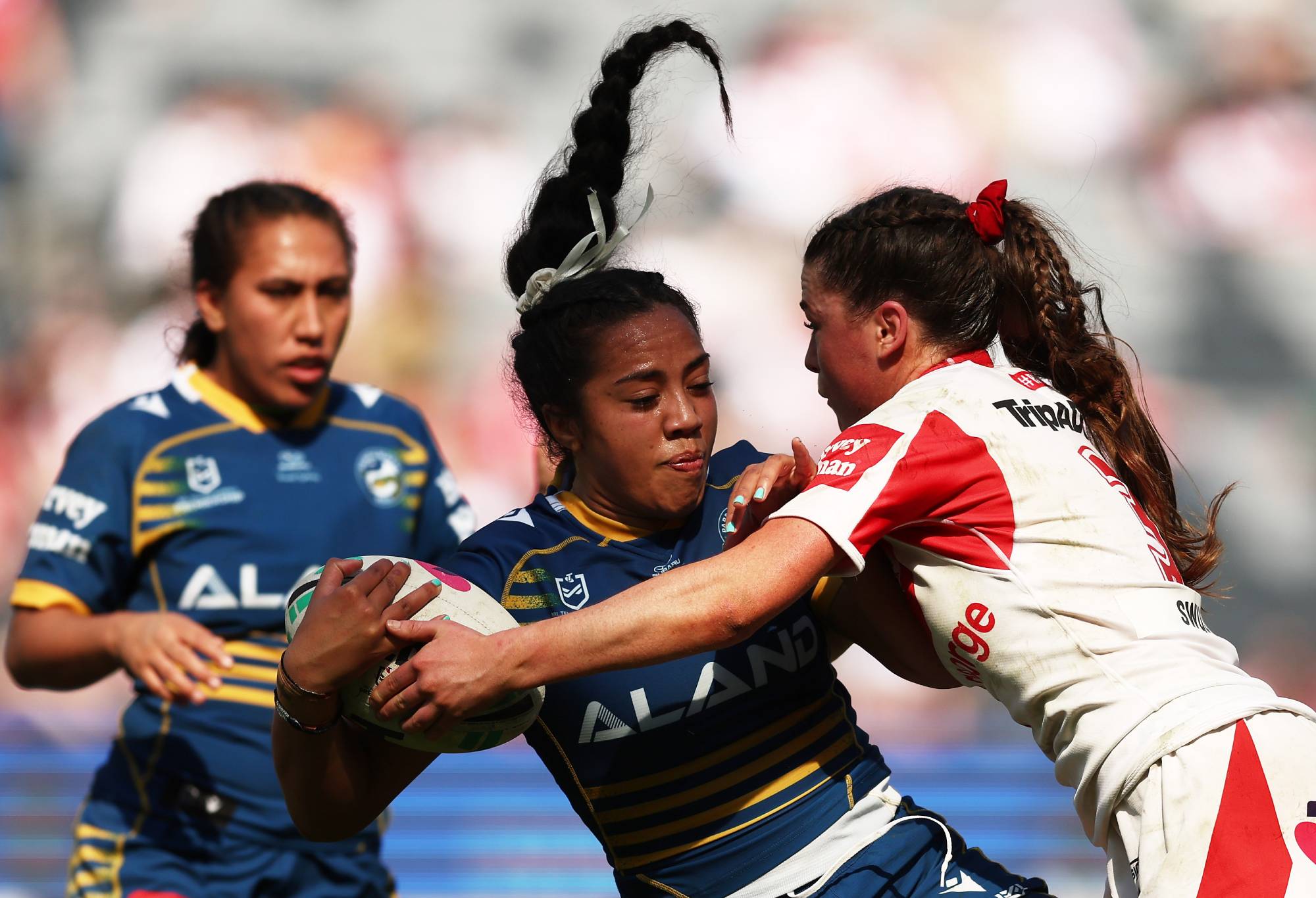 SYDNEY, AUSTRALIA - AUGUST 28: Christian Pio of the Eels is tackled during the round two NRLW match between Parramatta Eels and St George Illawarra Dragons at CommBank Stadium, on August 28, 2022, in Sydney, Australia. (Photo by Matt King/Getty Images)