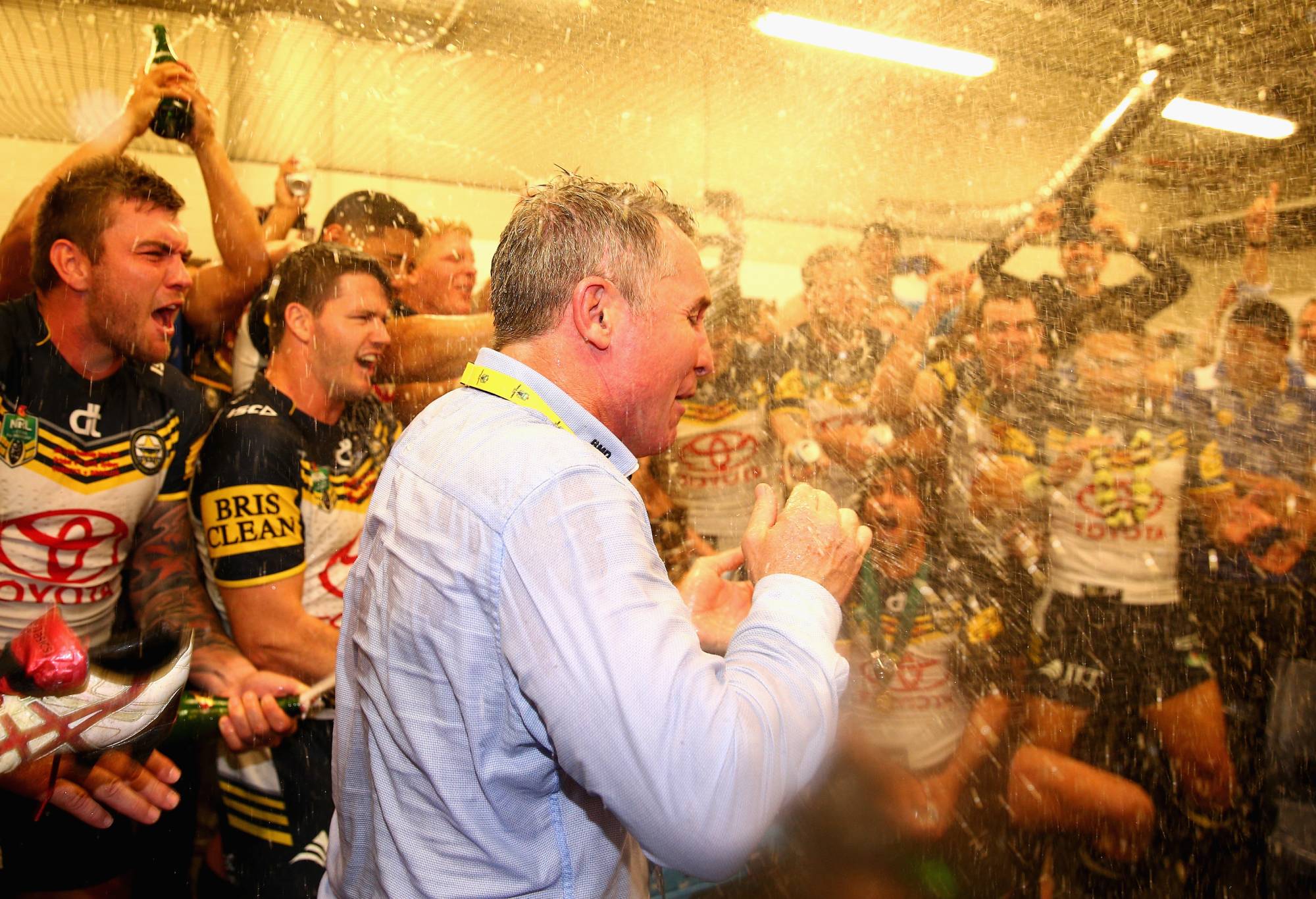 SYDNEY, AUSTRALIA - OCTOBER 04: Cowboys coach Paul Green is sprayed by his players with champagne after winning the 2015 NRL Grand Final match between the Brisbane Broncos and the North Queensland Cowboys at ANZ Stadium on October 4, 2015 in Sydney, Australia. (Photo by Cameron Spencer/Getty Images)