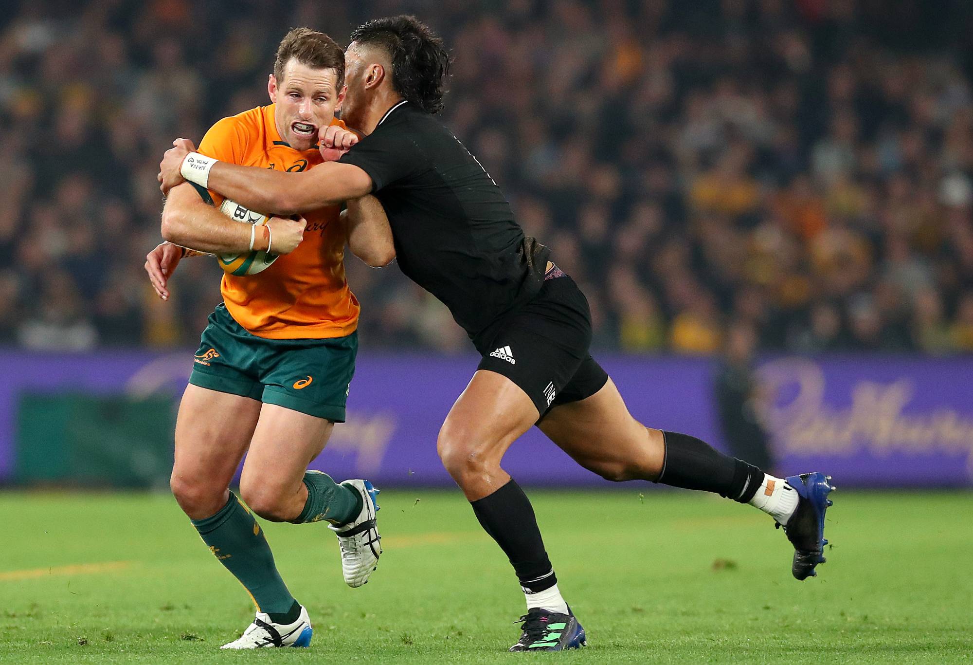 Bernard Foley of the Wallabies is tackled by Rieko Ionae of the All Blacks during The Rugby Championship & Bledisloe Cup match between the Australia Wallabies and the New Zealand All Blacks at Marvel Stadium on September 15, 2022 in Melbourne, Australia. (Photo by Kelly Defina/Getty Images)